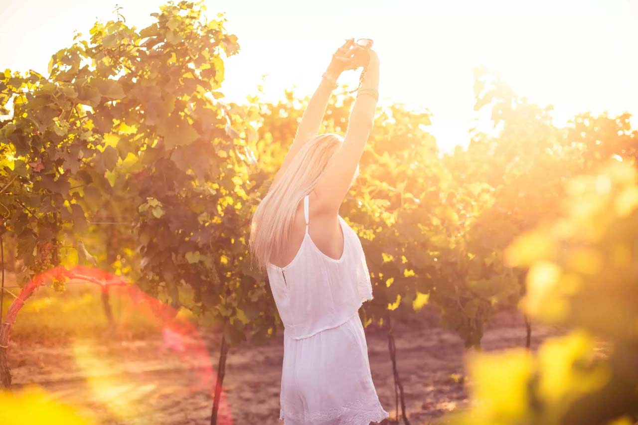 Young girl dancing in a vineyard