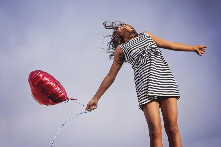 Happy girl with a balloon