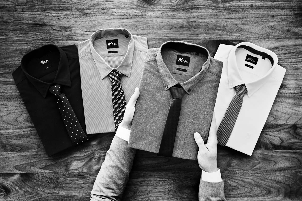 businessman selecting shirt to wear